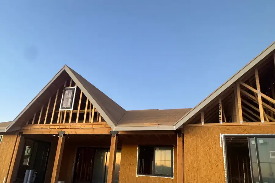 The sheathed shell of a custom home built by Quest Construction