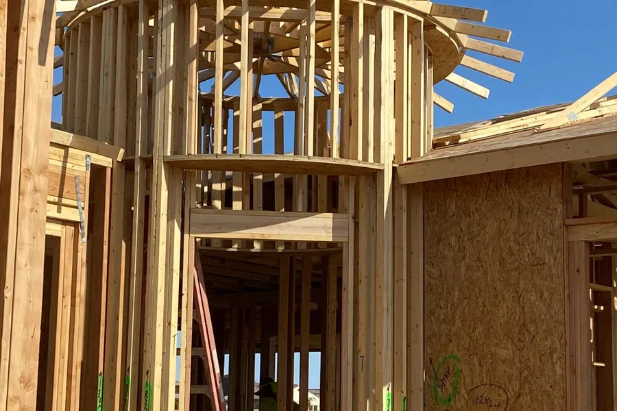A curved turret framed in timber with its rafters radiating from the centre