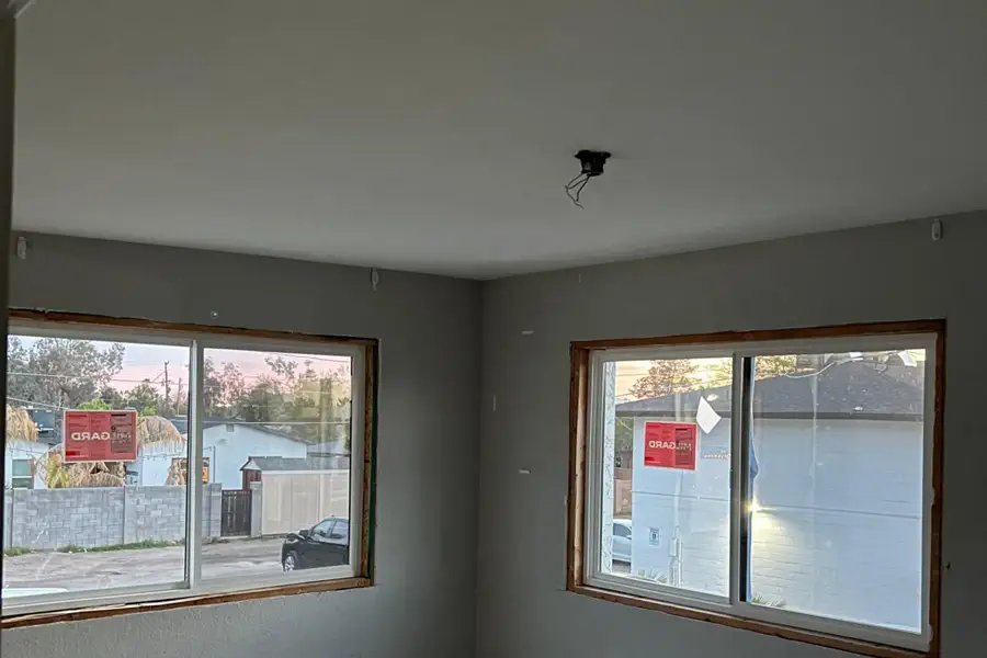 A finished interior with new windows on a Quest Construction project