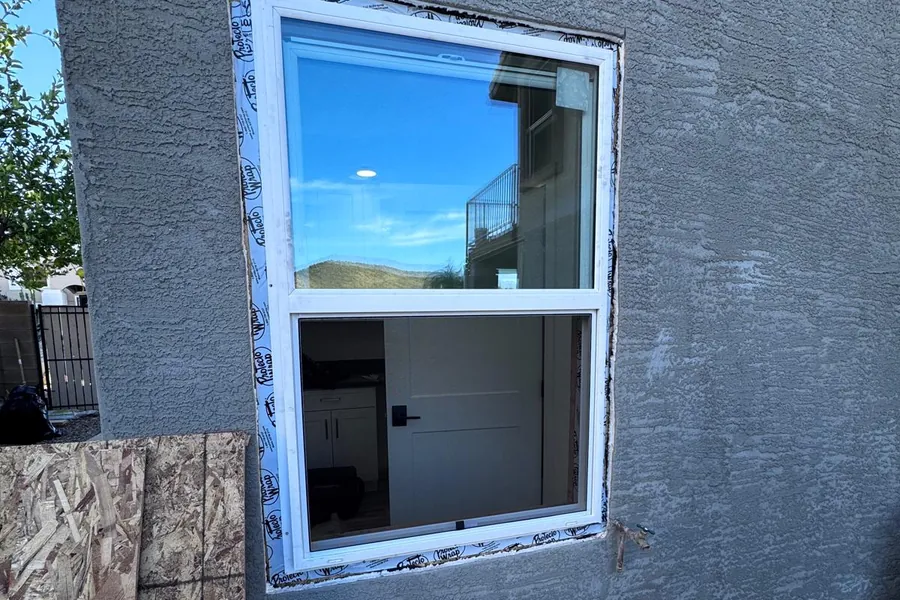 A new window set and flashed into a stucco wall
