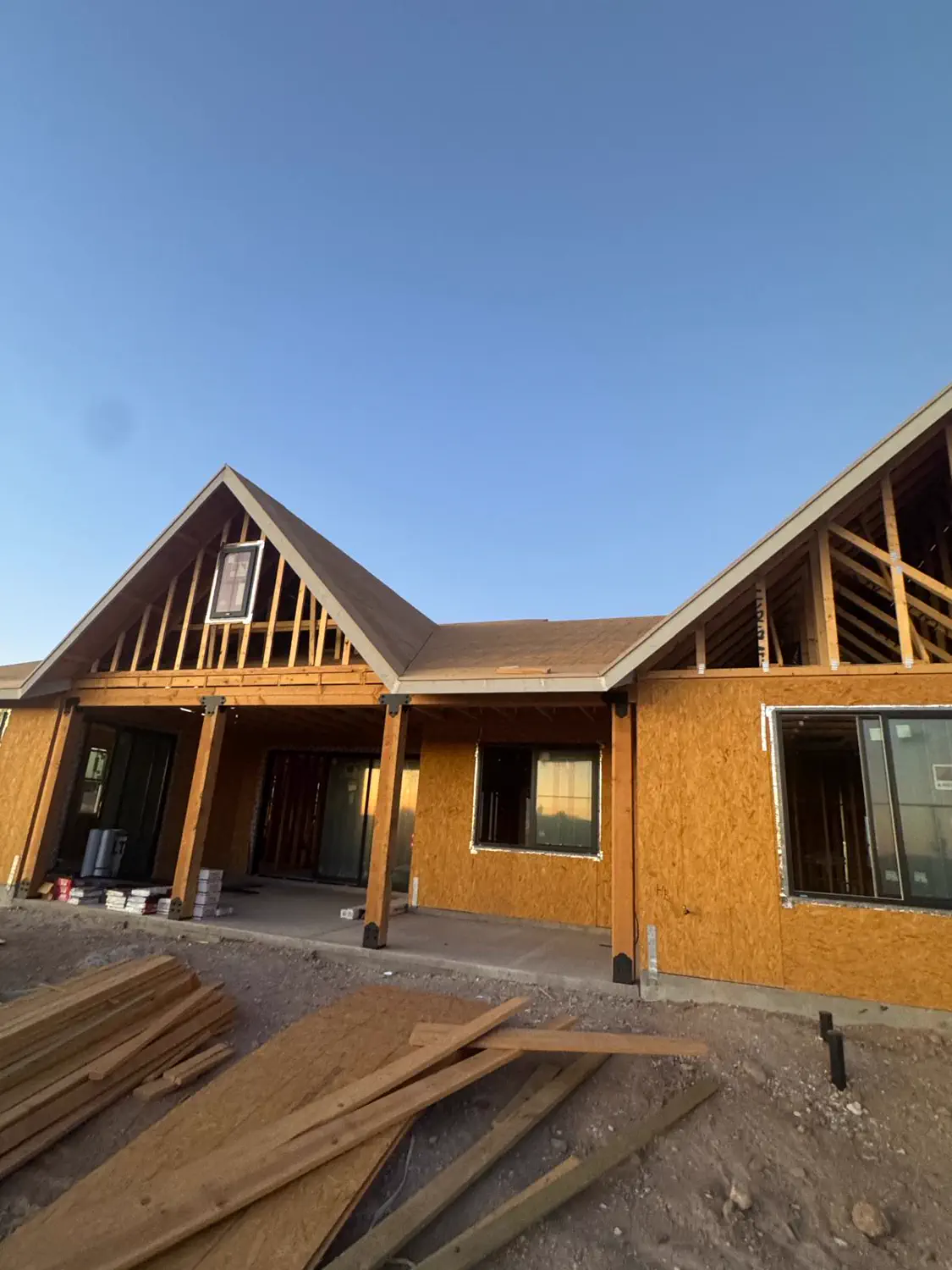 The sheathed shell of a custom home built by Quest Construction