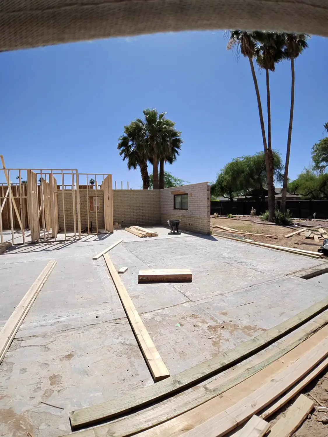 New framing tied in alongside an existing block wall