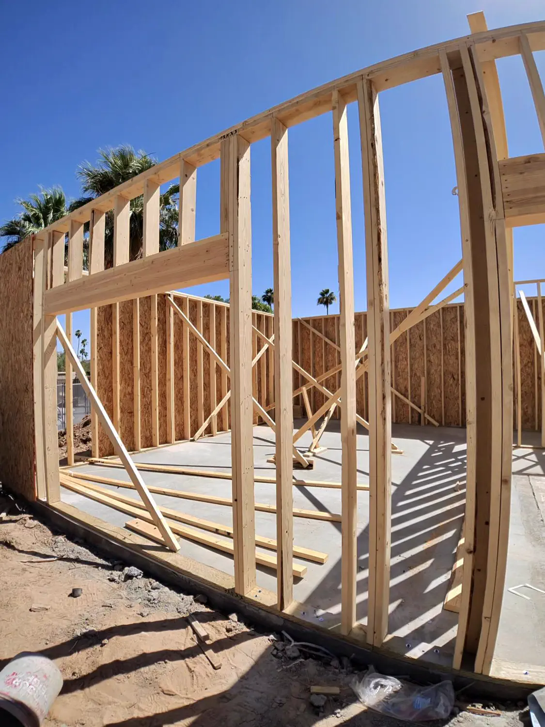 A curved framed wall braced on the slab