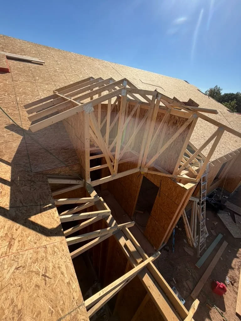 Structural framing around a large opening in the roof deck