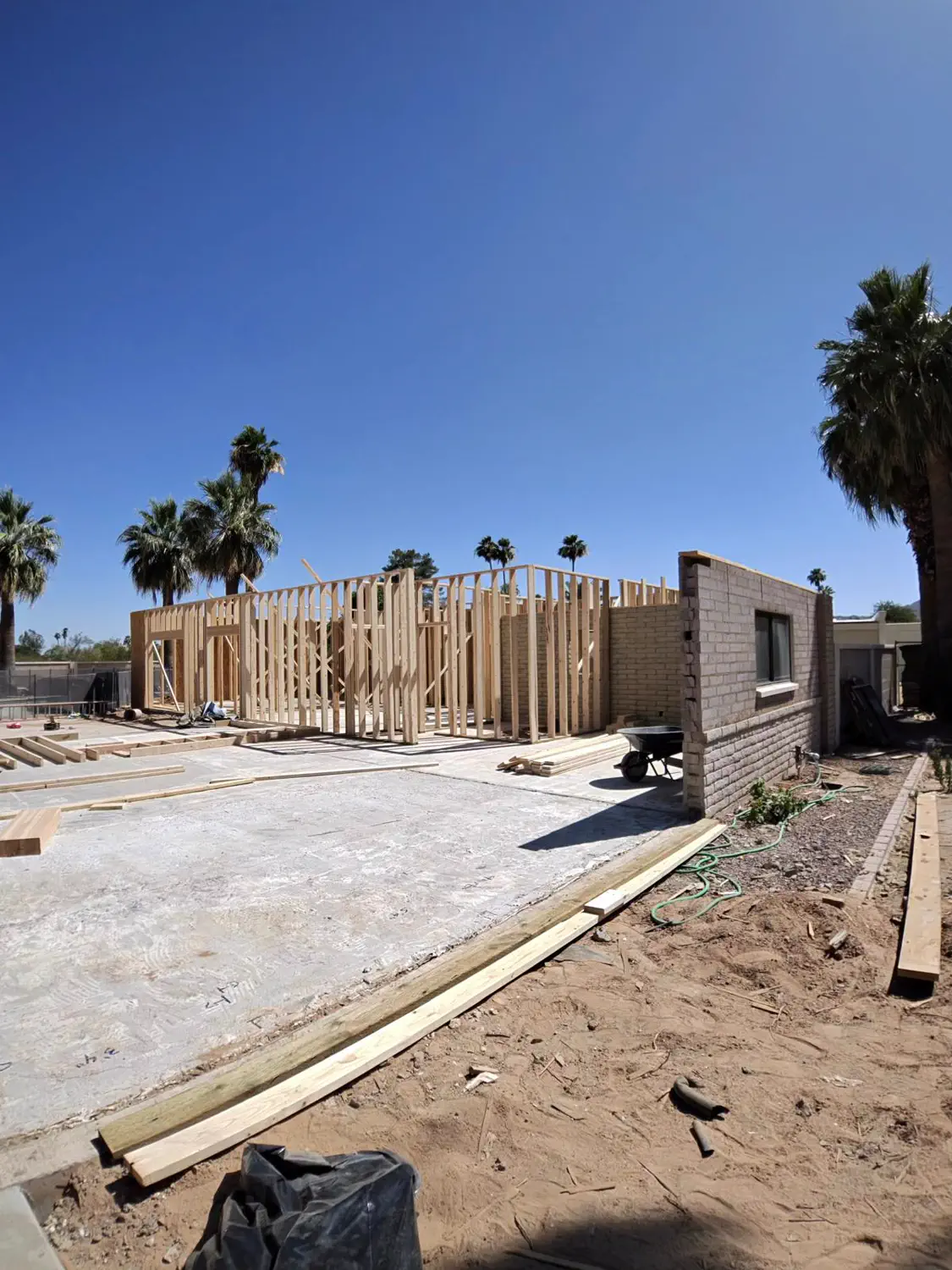 A long framed wall running the length of a new slab
