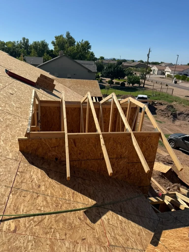 A framed opening surrounded by roof sheathing