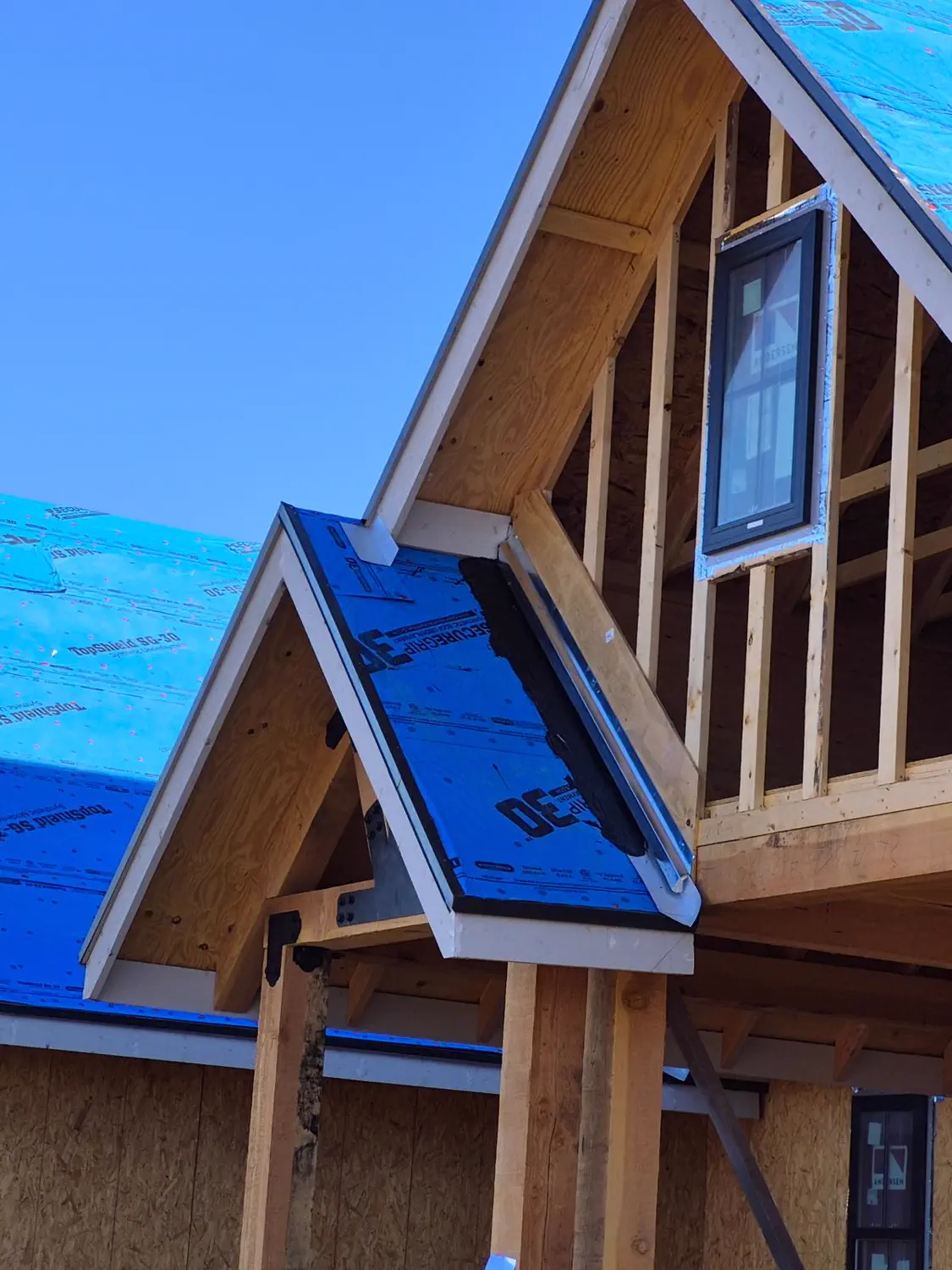 A gable window framed and set on a custom home