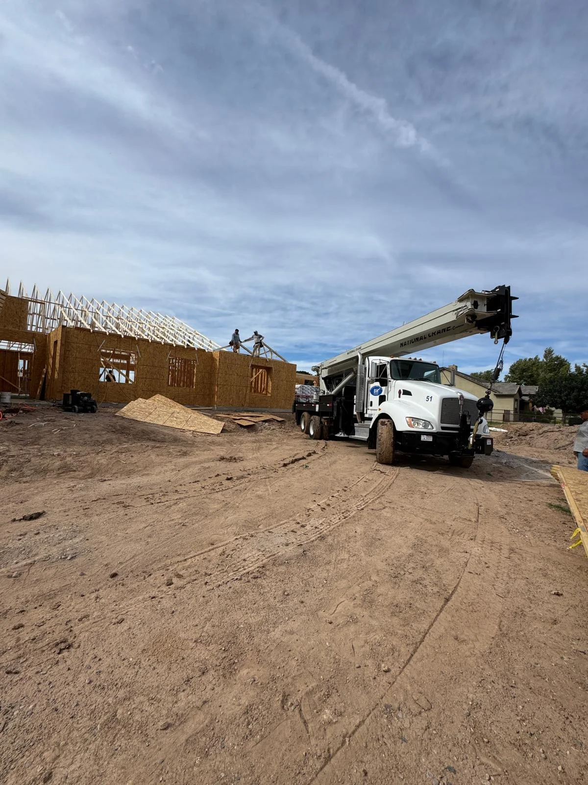 Crane working at the residential home construction site