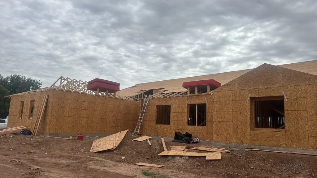 Front angle of a sheathed house under construction