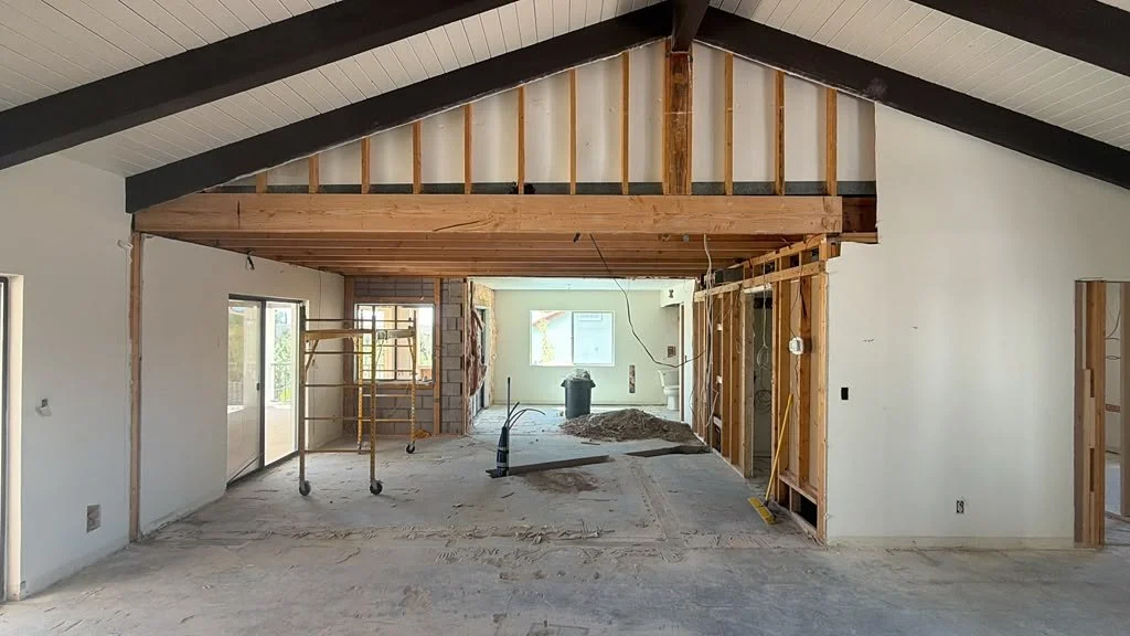 Open interior during a remodel, with wall framing visible
