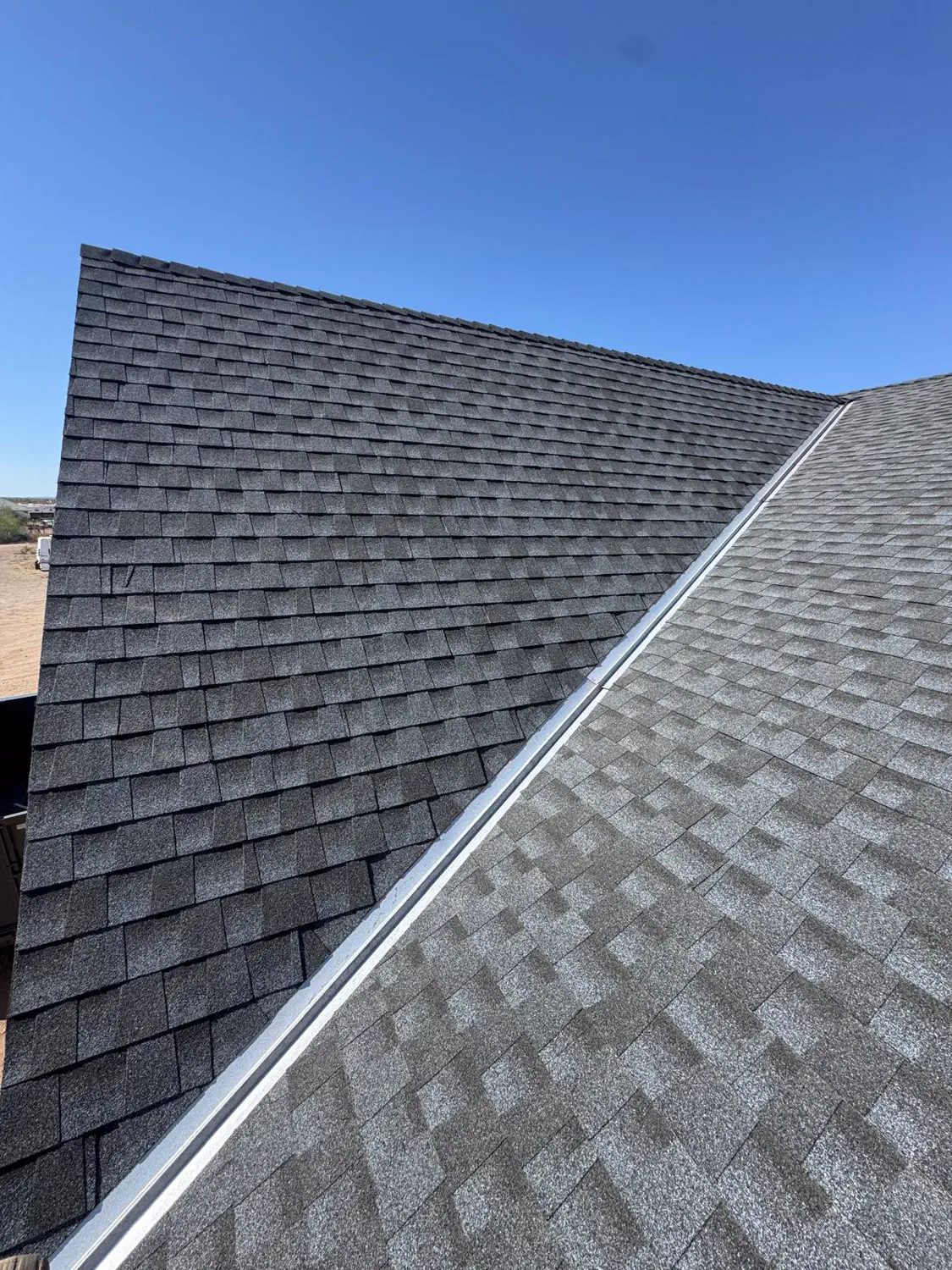 Architectural shingles laid across a new roof