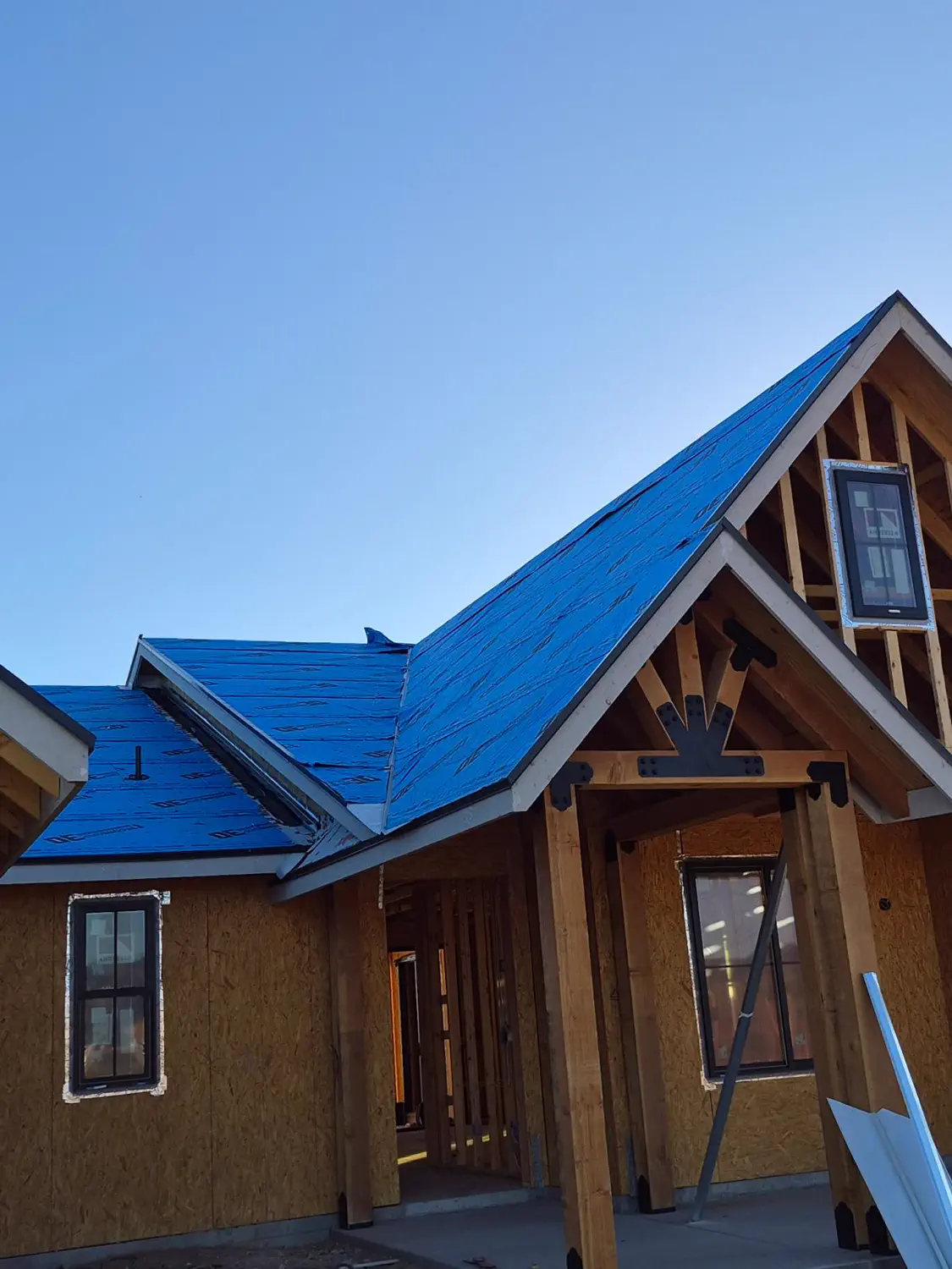 Roof underlayment down and gables framed on a custom home
