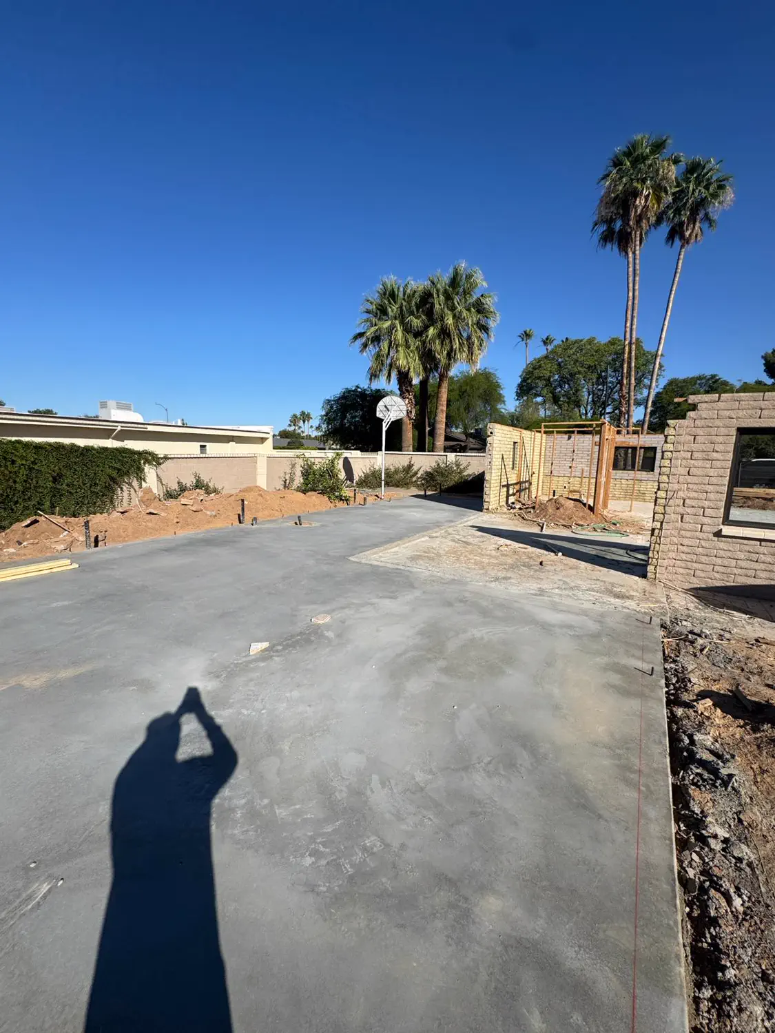 A freshly poured and floated concrete slab on a Quest Construction build