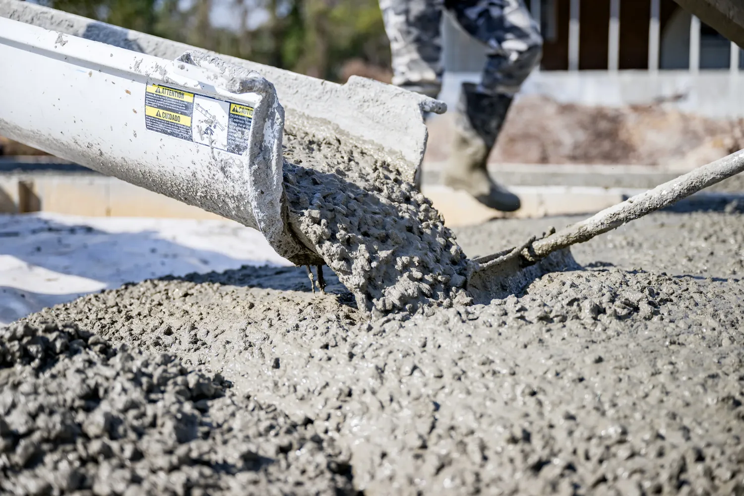 Concrete running down the chute onto a prepared subgrade